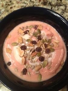 Strawberry-peach fro-yo with sunflower seed cashew almond and raisin trail mix topping. 